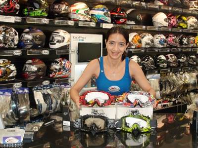 Girl showing the store accesories.
